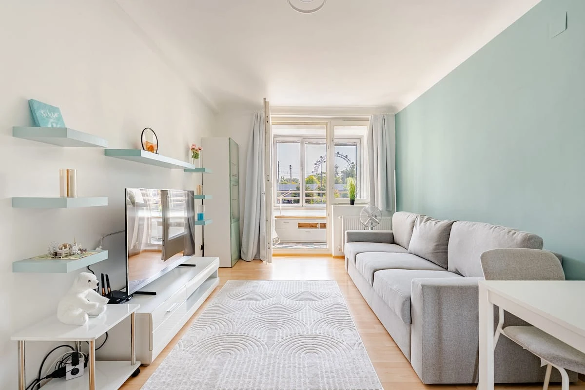 Living room of the Loggia Apartment with a view of the Prater Ferris wheel
